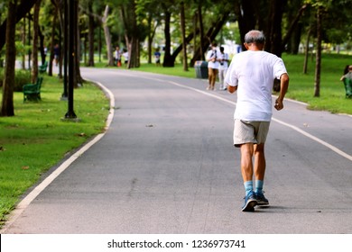 Old Man Is Running In The Public Park