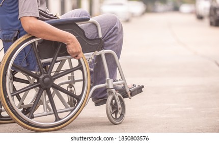  Old Man Sabled In Wheelchair On Road, Soft Focus