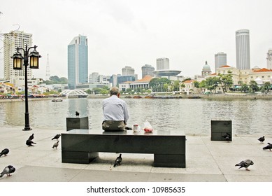 Old Man Seating Alone In The Park