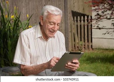 Old Man Senior Citizen Using Tablet Computer