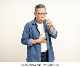 Old man senior have throat irritation mucus and coughing. Fever headache respiratory tract infection. Mature man unhealthy Sickness need to consult a doctor and get treatment. - Powered by Shutterstock