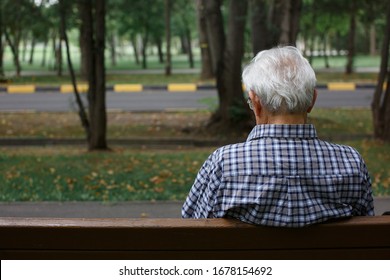 The Old Man, Senior Sitting On A Bench In The Park