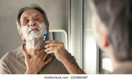 Old Man Shaves His Beard