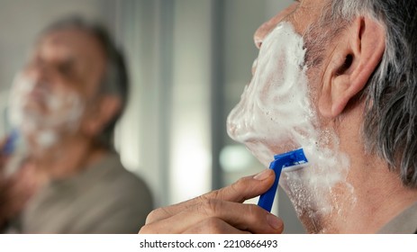 Old Man Shaves His Beard