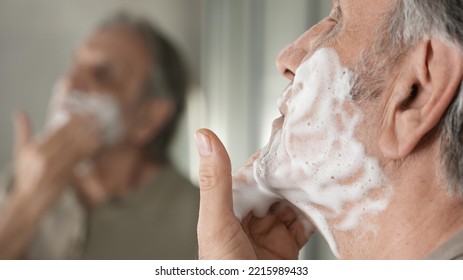 Old Man Shaves His Beard	