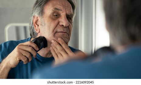 Old Man Shaves His Beard	