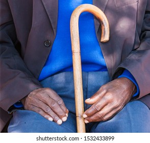 Old Man Sitted Holding His Walking Stick