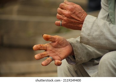 An Old Man Sitting On The Steps, Captured The Gestures Of The Old Man's Body Language 