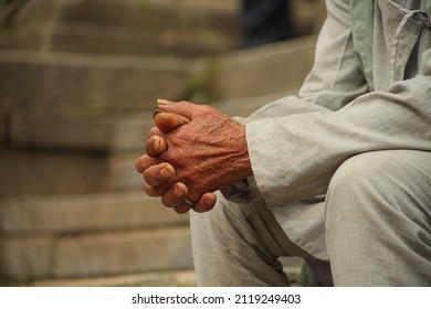 An Old Man Sitting On The Steps, Captured The Gestures Of The Old Man's Body Language 