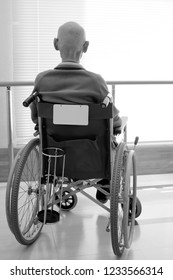 Old Man Sitting On Wheelchair In Hospital