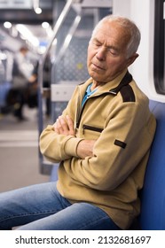 Old Man Sleeping In Subway Car