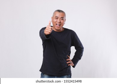 Old man smiling while showing thumbs up gesture, positive or agree expression concept, isolated on white background