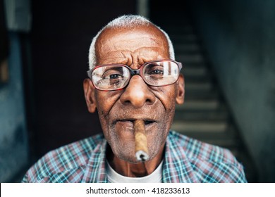 Old Man Smoking Cigar In Cuba