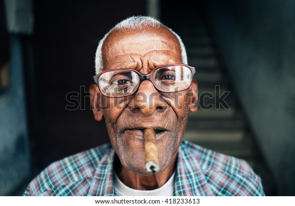 Old man smoking cigar in
Cuba