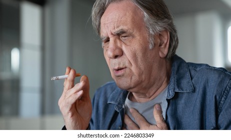 Old man smoking a cigarette