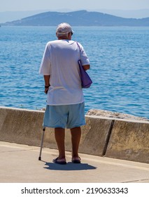 Old Man Standing By The Sea