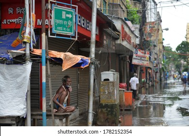 A Old Man Stuck After Heavy Rain , The State Authorities Imposed Two Days A Week Lockdown To Fight Against The Surge In COVID-19 Coronavirus Cases, In Kolkata On July 23, 2020.