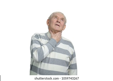 Old Man Suffering From Sore Throat. Aged Man Touching Neck In White Isolated Background.