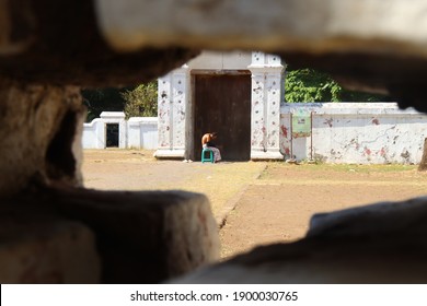 An Old Man Sunbathing, Doing Rituals In Kanoman Keraton. Selective Focus Photo. Cirebon - Indonesia, September 14, 2020