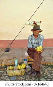 Old Man In Trinidad, Cuba, With Chicken On Head