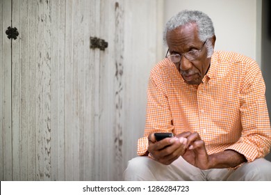 Old man using cell phone