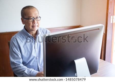 an old man using computer and stress looking or watching desktop monitor for business financial monitoring, elder working at home, retired man hobby