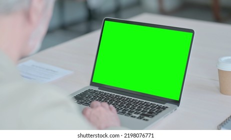 Old Man Using Laptop With Green Screen