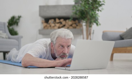 Old Man Using Laptop, Laying On Excercise Mat 