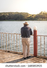 Old Man Watching The Sunset , In The River