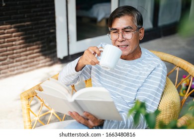 Old Man Wearing Eyeglasses Quite Cry While Reading The Book.