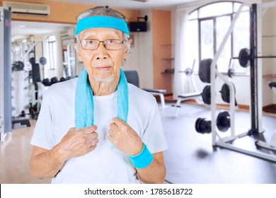 Old Man Wearing Sportswear While Standing In The Fitness Center