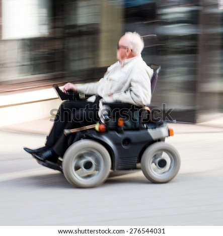 old-man-wheelchair-intentional-motion-450w-276544031.jpg