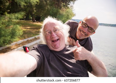 Old Man In Wheelchair Taking A Selfie