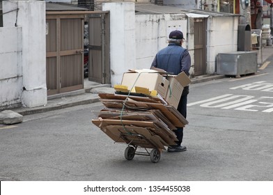 An old man who collects recycling wastepaper - A poor Korean elderly who collects and sells recycling wastepaper - Shutterstock ID 1354455038