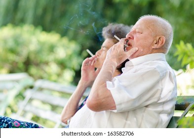 Old Man And Woman Smoking