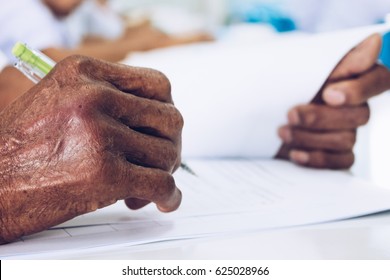 Old Man Writing With A Pen The Document