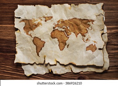 Old map on parchment on the wooden background