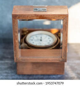 An Old Marine Chronometer In A Wooden Case