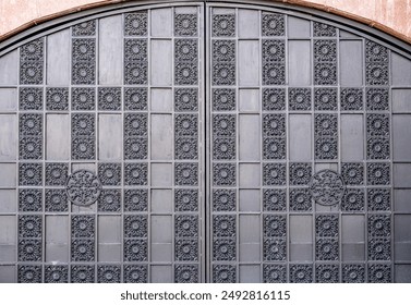 Old massive iron gates with patterns.