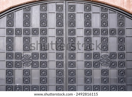 Old massive iron gates with patterns.