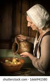 Old Master Style Renaissance Portrait Of A Woman Preparing Food In An Antique Kitchen