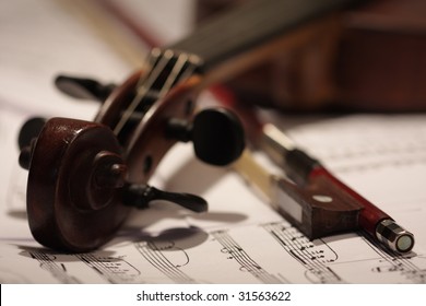 Old master violin with bow and note background