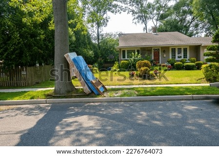 Image, Stock Photo Discarded mattress on the sidewalk in the light of a street lamp in front of an anonymous hotel façade