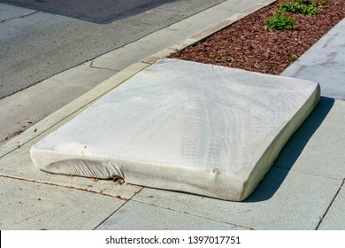 Old Mattress Dumped On The Street. Illegal Dumping Disrupts Natural Land And Water Environment, Harms Plants And Wildlife, Causes Health And Safety Hazards.