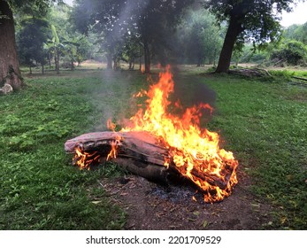 An Old Mattress In The Garbage Dump Was Burned. The Black Smoke That Spewed Into Air Pollution, Blurry Flames.