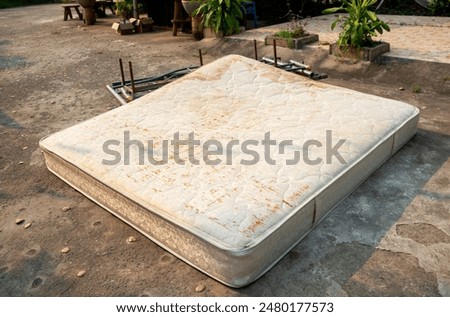 Similar – Image, Stock Photo Discarded mattress on the sidewalk in the light of a street lamp in front of an anonymous hotel façade