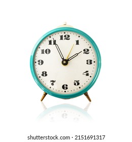 Old mechanical alarm clock isolated on white background with reflection. Vintage blue metal classic analog alarmclock, retro watch isolate. Front view.