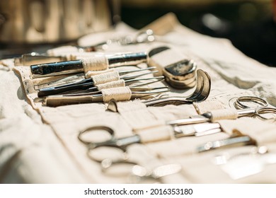 Old Medical And Surgical Instruments. Many Surgical Instruments For Surgery. Old Different Metal Medical Instruments Objects. Retro Stainless Surgical Equipment Tools.