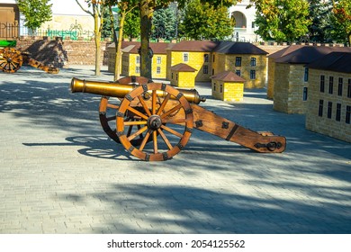 Old Medieval Artillery Canon Before A Brick Wall