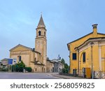 Old medieval cathedral in summer day. Beautiful italian church San Rocco with belfry. Parish of St. Ignazio di Loyola. Abbey of Pontevico Brescia Italy. Chiesa Di San Rocco